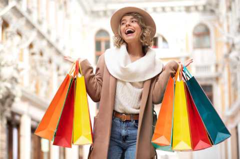 medium-shot-excited-woman-shopping_23-2149313440