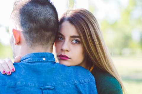 Young woman comforting unhappy friend
